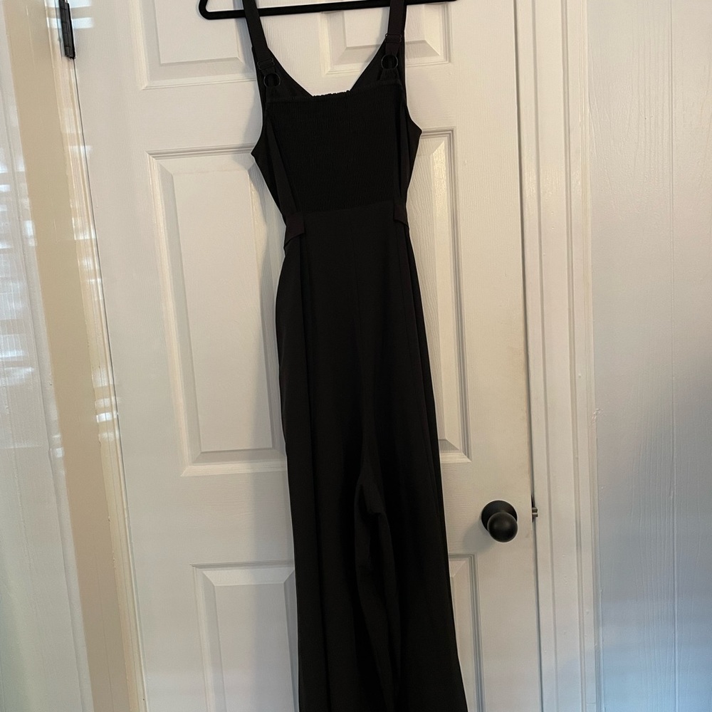 Black jumpsuit in Universal Standard sizing of XS which is like a 10-12